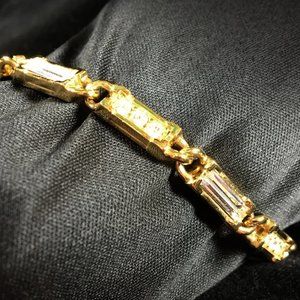 Elegant Signed Swarovski Gold and Clear Crystal Tennis Bracelet